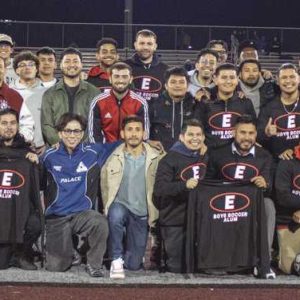 On Oct. 22 in a home game at Everett Memorial Stadium against Somerville, the Everett High School boys soccer team celebrated Senior Night, where over 70 alumni, shown posing for a photo at halftime, returned to watch their successors on the pitch, who are led by first-year coach and former Tide player Rodney Landaverde. The 2024 team was able to send them home happy with a 2-0 victory over the Highlanders. (Courtesy photo)