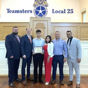 Left to right: Teamsters Local 25 Field Representative Eric Logan; Regan Associates, Chartered CEO Paul Regan; Angel Romero Morales; Jose Angel Romero; Teamsters Local 25 Field Representative Milton DePina.