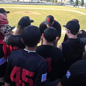 Everett Little League Williamsport all-star manager Kevin Blatt speaks to his team prior to the District 12 opener against Charlestown last Friday night (June 27) at Langone Field in the North End. (Courtesy photo)