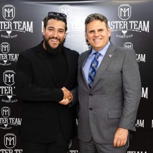Master Team Barbershop owner and head barber Ygor Rodrigues Barbosa (left) and Mayor Gary Christenson.