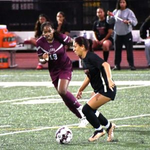 Everett High School girls soccer player Yelsa Garcia, shown beginning another scoring play, was recently chosen as a first-team 2024 EMass all-star after leading the Tide in scoring with 22 goals and 5 assists this fall. (Courtesy photo)