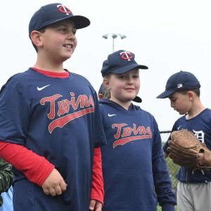 Luca Bartalini and Marina Beaudoin marched around the field at Griswold Park in the Revere Little League parade on Saturday.