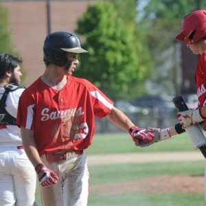 7.	Cam Soroko and Michael Howard of Saugus celebrate at the plate after a scoring run by Soroko. Saugus beat Everett 13-2 Wednesday.