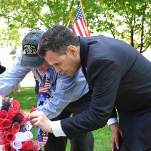 HONORING MALDEN’S FALLEN HEROES: Veterans’ Services Officer Kevin Jarvis and Mayor Gary Christenson place poppies on the wreath to honor Malden’s fallen soldiers during Monday’s Memorial Day Ceremony. See page _ for photo highlights. (Advocate photo by Emily Harney)