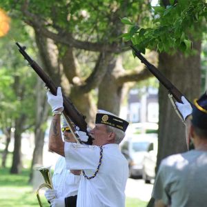 Dave Chamberlain performs a gun salute for the servicemen and women lost this past year.