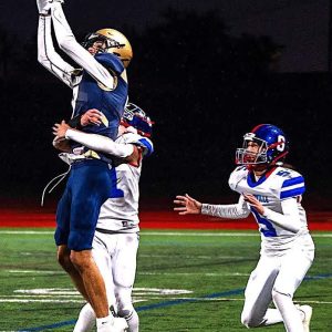 Malden High 2023 6-5 senior captain Gabriel Vargas Cardoso is shown leaping to snag a catch in a game played earlier this year. He leads Malden in receptions and touchdown catches (seven) this year. (Advocate Photo/Henry Huang)