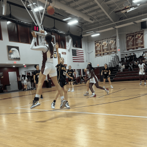 Mystic Valley Regional Charter School Lady Eagles’ senior captain Aya Abbassi takes a shot at the basket.