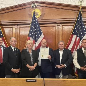 Shown from left to right: Wart 3 City Councillor Anthony Cogliandro, Councillor-at-Large Steve Morabito, Ward 2 Councillor Ira Novoselsky, City Council President Pro Tempore/Ward 1 City Councillor Joanne McKenna, honoree Marc Silvestri, Councillors-at-Large Dan Rizzo and Gerry Visconti and Ward 6 City Councillor Ricky Serino following the presentation honoring Silvestri for his work as the city’s Veterans Services Director, his service to his country and his new position as Ombudsman for the Soldiers’ Home in Chelsea.