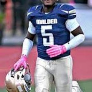 James Hyppolite, a 2025 Malden High graduate, wrote the winning essay for the Peter Donoghue Sr. Golden Eagle Award, recounting the inspiration he received from Malden High Football Head Coach Witche Exilhomme. (Courtesy/Malden HS Athletics)