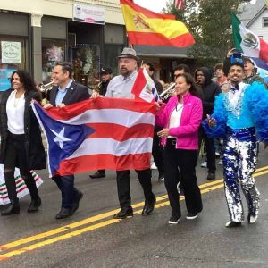 Mayor Gary Christenson and Gladys Rivera Rogers are shown leading the parade in Maplewood Square during the 9th Annual Hispanic Heritage Celebration hosted by The North Shore Hispanic Association.  (Courtesy photo)