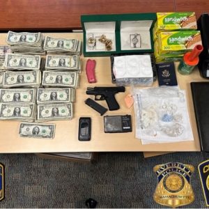 Large amounts of cash, a firearm and other property, including watches and jewelry, are shown above.  (Photos courtesy of Revere Police)