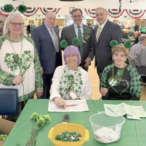 Pictured in the rear, from left to right: former Mayor John Hanlon, Mayor Robert Van Campen and Rep. Joe McGonagle; in front are volunteers.