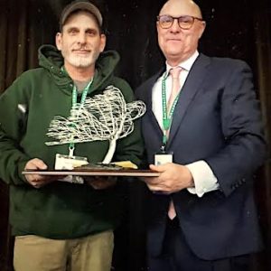 Malden Tree Warden Chris Rosa, who is shown above receiving a statewide award from Massachusetts Tree Warden and Forestry Association President Ed Olsen as “Tree Warden of the Year,” made a presentation on the state of trees in Malden at Tuesday night’s Malden City Council meeting. (Courtesy Photo/MTWF)